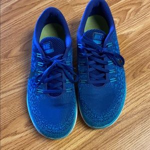Blue Nike running shoes